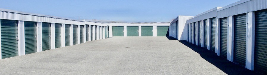 Rows of storage units either side of the drive-up yard